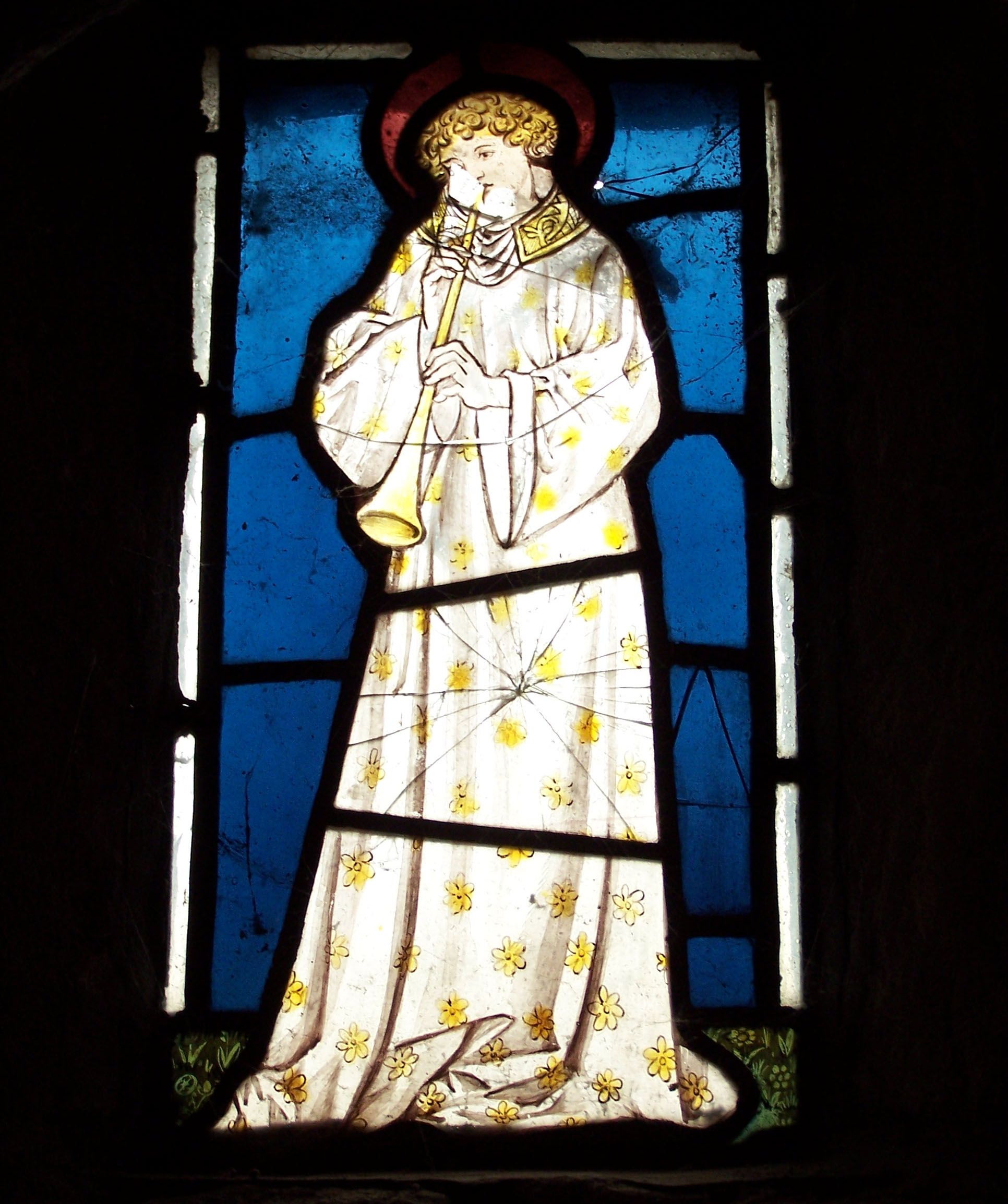 The Angel Window, over the side door in the chancel, may be the only surviving medieval stained glass window in the church.