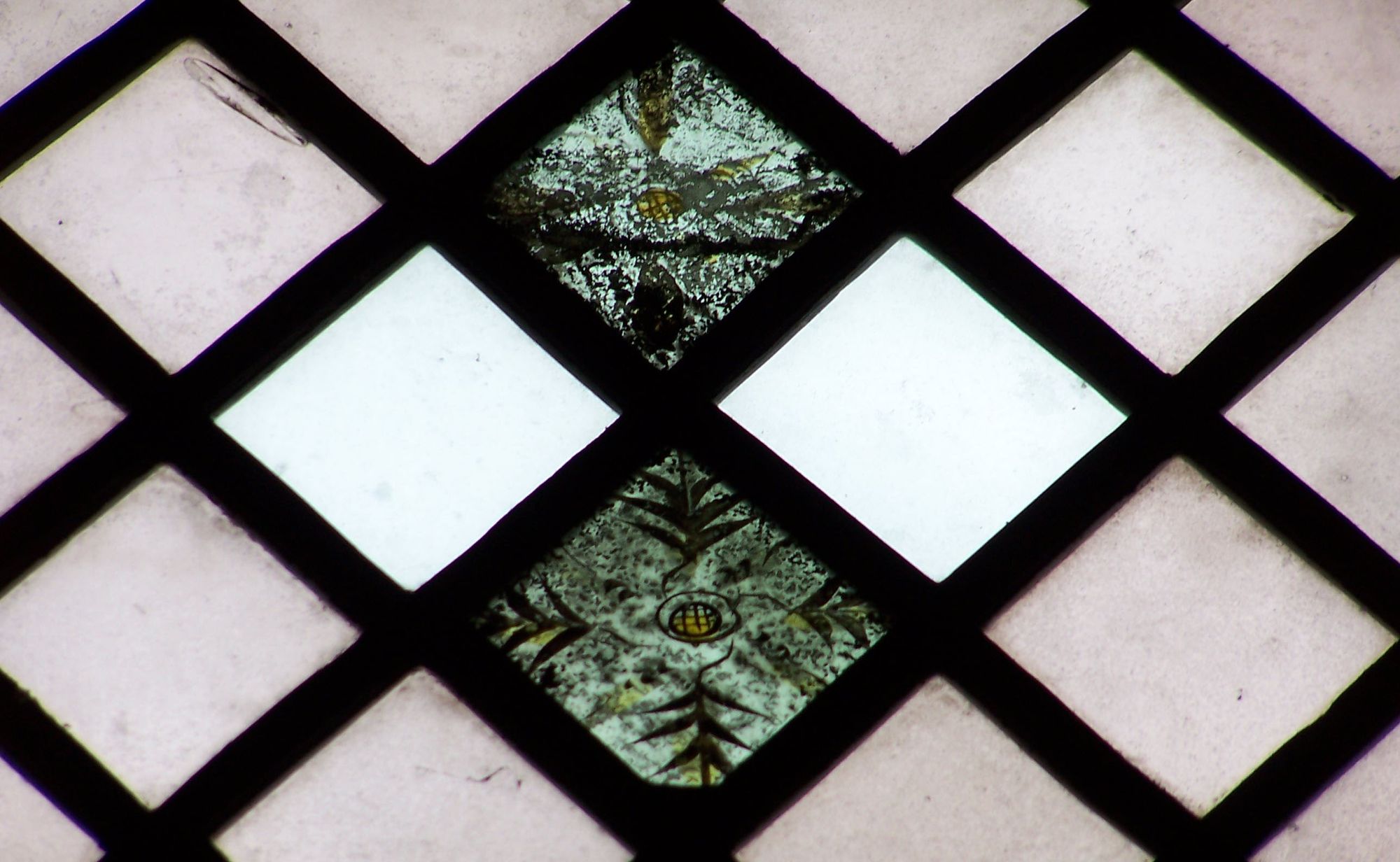 Medieval glass fragments in the vestry windows.