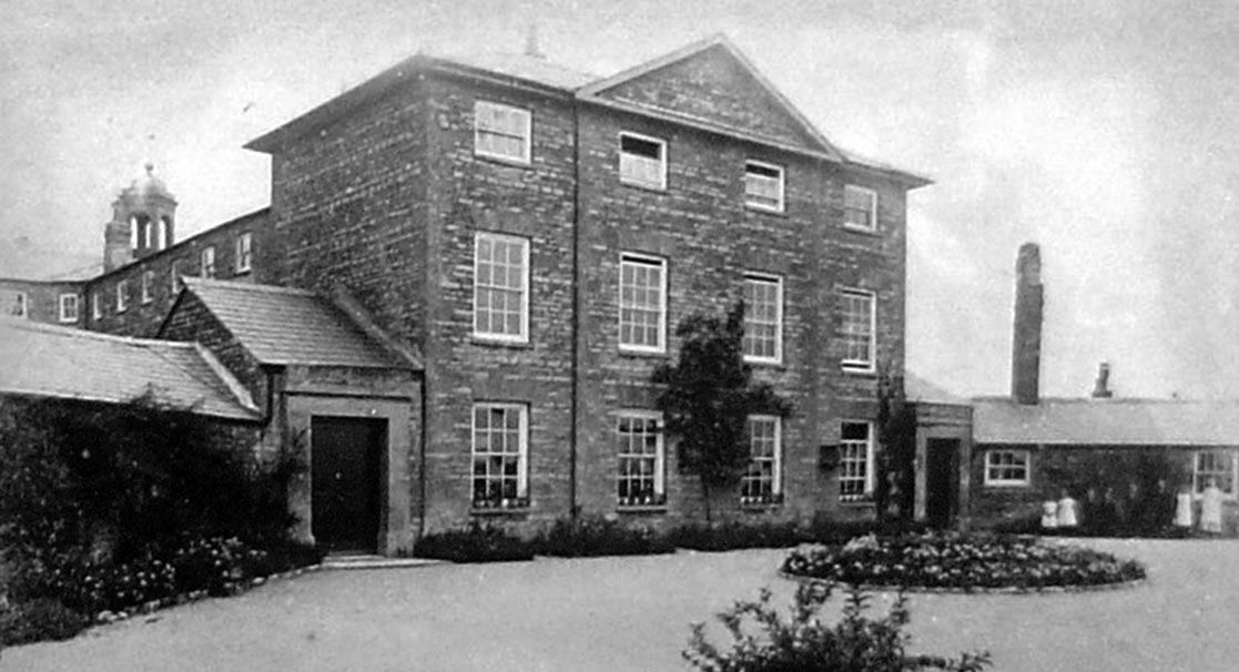 The front elevation of the Workhouse. Note the separate entrances for men on one side and women on the other, and the bell tower above the centre of the building.