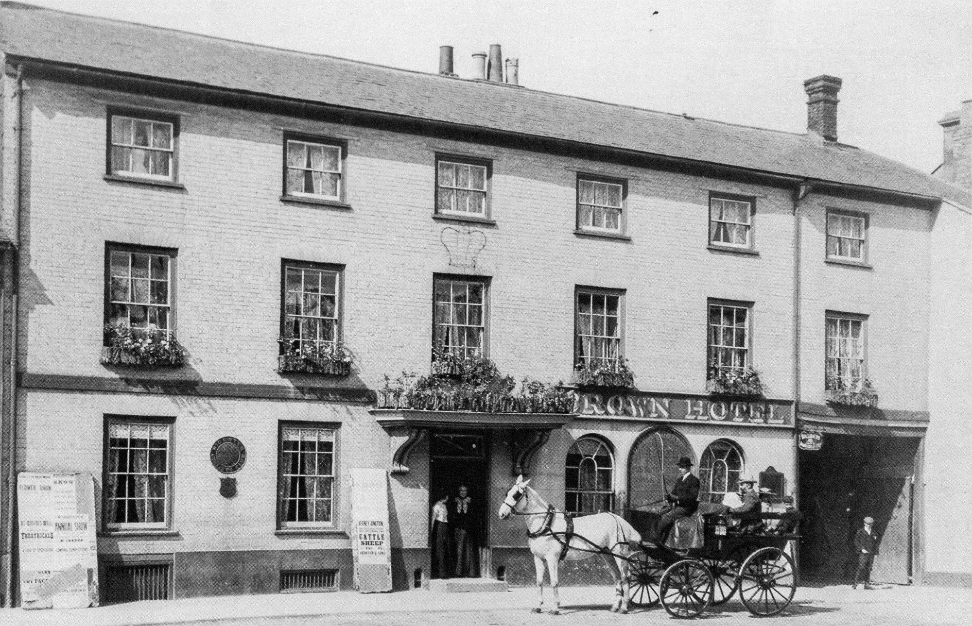 The front of the hotel in 1903 when John Drover took over as proprietor. John is seen sitting in the back of the cart while his wife, Margaret, stands in the hotel doorway.